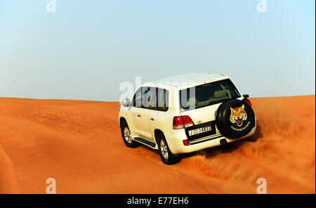 The Dubai desert trip in off-road car is major tourists attraction Stock Photo