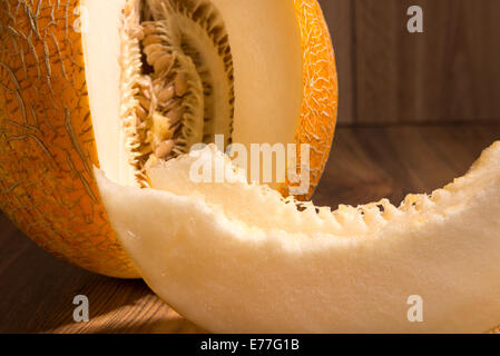 yellow netted melon - the fruit and slices Stock Photo
