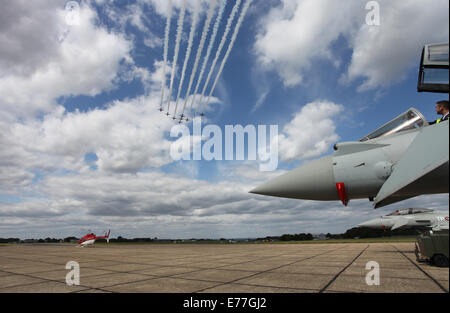 Red Arrows display team arriving to park at Biggin Hill airport, Eurofighter Typhoon in foreground. Stock Photo