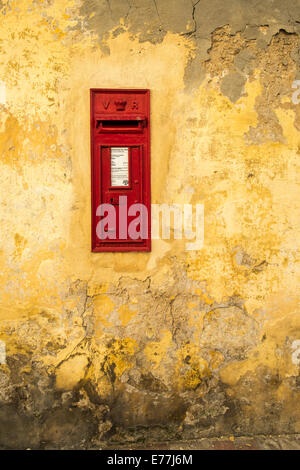 Old fashioned post box mounted into wall on Gozo Island in the Mediterranean Stock Photo