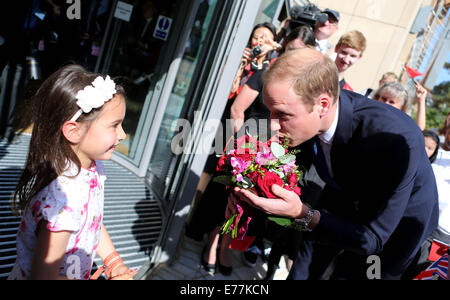 Oxford, UK. 8th Sep, 2014. Prince William (R), Duke of Cambridge, receives flowers for his wife Catherine, Duchess of Cambridge, from Malaviika Mitter (L) as he arrives to formally inaugurate the Dickson Poon University of Oxford China Centre Building in Oxford, the United Kingdom, on Sept. 8, 2014. Prince William unveiled the Dickson Poon University of Oxford China Centre here on Monday. Credit:  Han Yan/Xinhua/Alamy Live News Stock Photo