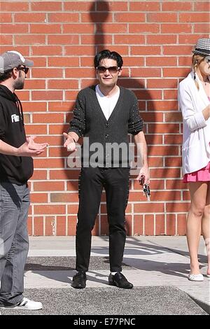 Corey Feldman dressed in the style of Michael Jackson with black shoes, white socks and a studded cardigan, enjoys a day out with his girlfriend and friend in Beverly Hills  Featuring: Corey Feldman Where: Los Angeles, California, United States When: 06 M Stock Photo