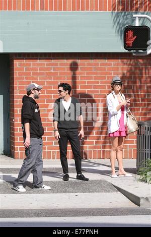 Corey Feldman dressed in the style of Michael Jackson with black shoes, white socks and a studded cardigan, enjoys a day out with his girlfriend and friend in Beverly Hills  Featuring: Corey Feldman Where: Los Angeles, California, United States When: 06 M Stock Photo