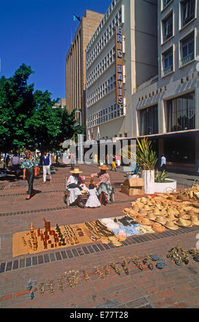Street scene with tourist souvenirs along sidewalk in Harare City, the capital of Zimbabwe in Southeast Africa Stock Photo