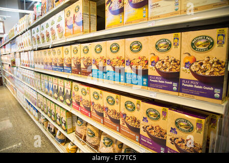 Organic breakfast cereal boxes on the shelves of a natural foods grocery store. Stock Photo