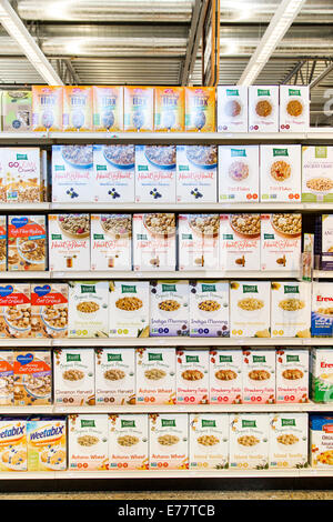 Organic breakfast cereal boxes on the shelves of a natural foods grocery store. Stock Photo