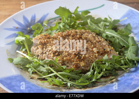 Tuna  breaded in sesame seeds and arugula Stock Photo