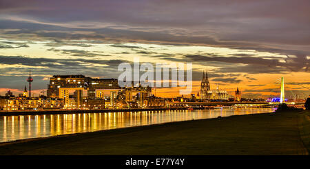 Panoramic view of the Rhine with Cologne Cathedral, Severinsbrücke Bridge, the Crane Houses, Great St. Martin Church and Stock Photo