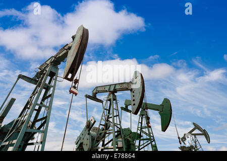 A row of oil pump jacks Stock Photo