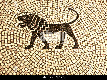 Antique mosaic pavement with central stylized wild animal, grunge tile background Stock Photo