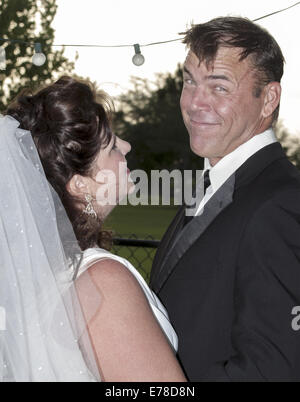 Evening wedding  picture of mid-life bride and groom.  Clermont Florida USA Stock Photo