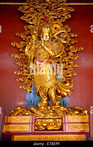 A gold figurine in the Lama Temple of Beijing Stock Photo