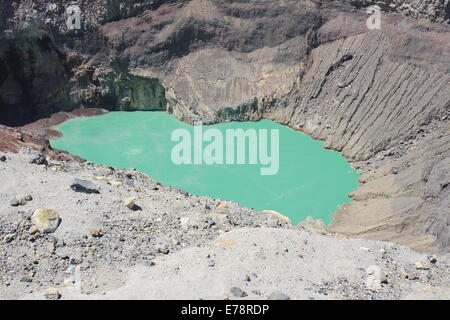 The blue-green lake in the crater of Santa Ana (Ilamatepec) volcano, El Salvador, bubbles slowly due to the geothermal heat. Stock Photo