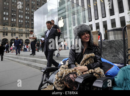 New York, USA. 9th Sep, 2014. Moon Ray waits to buy Apple's new products outside the Apple Store on 5th Avenue in New York, the United States, on Sept. 9, 2014. Apple Co. introduced two new smart phones, known as iPhone 6 and iPhone 6 Plus, plus a smart watch on Tuesday. © Wang Lei/Xinhua/Alamy Live News Stock Photo