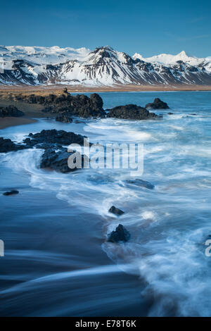 the coast at Budir with the mountains of Holsfjall and the Snaefellsnes Peninsula, Western Iceland Stock Photo