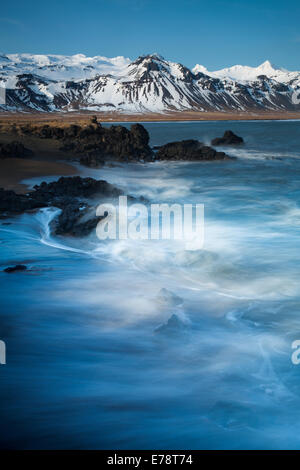the coast at Budir with the mountains of Holsfjall and the Snaefellsnes Peninsula, Western Iceland Stock Photo