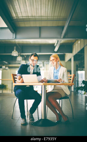 Two colleagues networking at meeting in office Stock Photo