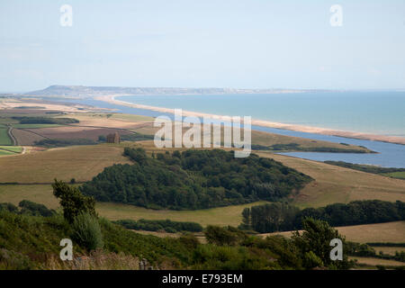 View west along Chesil beach tombolo and the Fleet lagoon from Abbotsbury to the Isle Portland, Dorset, England Stock Photo