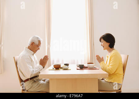 Senior adult Japanese couple in the kitchen Stock Photo