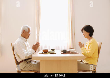 Senior adult Japanese couple in the kitchen Stock Photo
