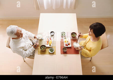 Senior adult Japanese couple in the kitchen Stock Photo
