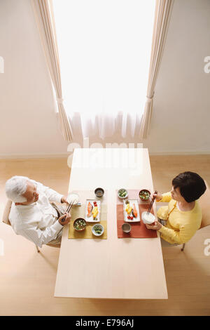 Senior adult Japanese couple in the kitchen Stock Photo