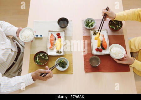 Senior adult Japanese couple in the kitchen Stock Photo