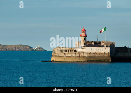 View of Dun laoghaire Harbour Lighthosue to Bailey Lighthouse Howth Head across Dublin Bay Stock Photo