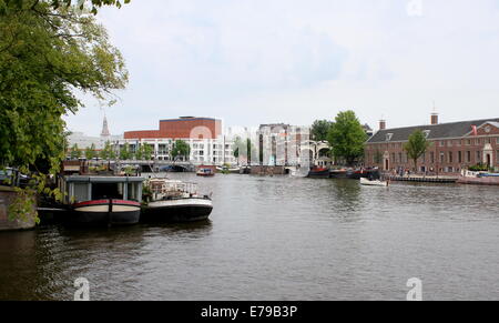 Hermitage  Museum at Amstel river bank in the Dutch capital Amsterdam, Stopera Opera House & City Hall in the background Stock Photo