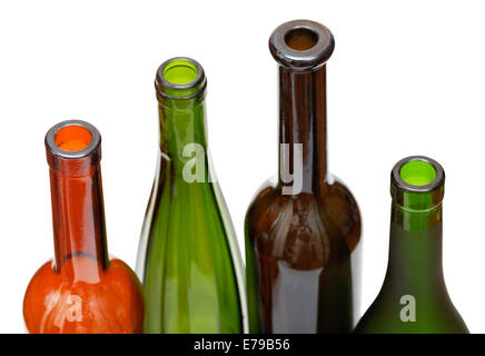 open bottlenecks of few colored wine bottles isolated on white background Stock Photo