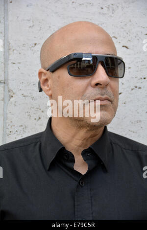 Portrait of a  man from Argentina named Andres wearing Google Glasses in Manhattan, New York City at Fashion Week