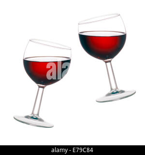 Backlit red wine glasses.