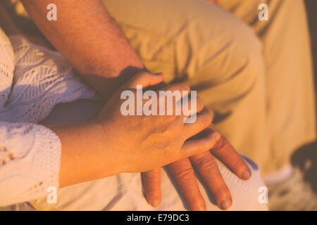 Senior couple holding hands Stock Photo