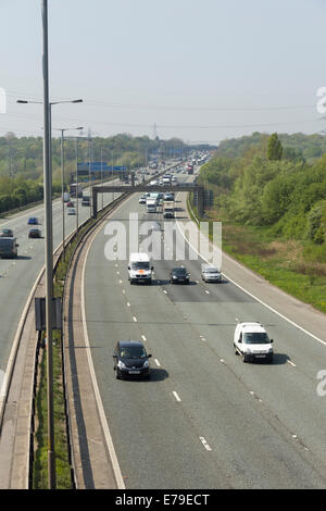 Traffic on M60 motorway four lane section at junction 17 passing under ...