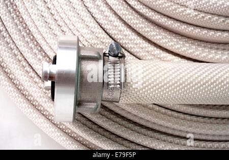 firefighter water hose isolated on white background Stock Photo - Alamy