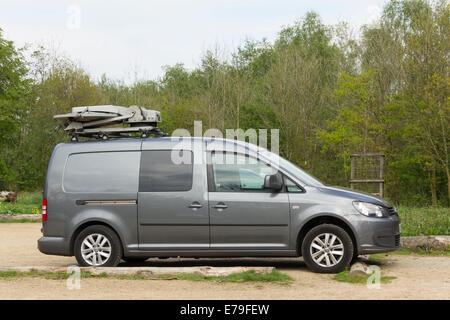 AvL Technologies Mobile vsat antenna in the stowed position, mounted on Rhino roof bars on the roof of a Volkswagen Caddy Maxi. Stock Photo