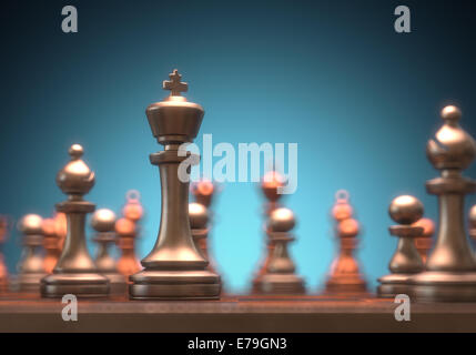 Chessboard with pieces of metal in depth of field view. Clipping path on the King piece. Stock Photo