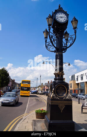 Cast iron Victorian clock tower and lamp standard, 1886, Great Whyte, Ramsey, Cambridgeshire, England Stock Photo