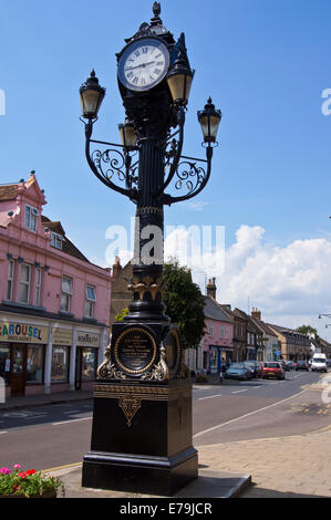 Cast iron Victorian clock tower and lamp standard, 1886, Great Whyte, Ramsey, Cambridgeshire, England Stock Photo