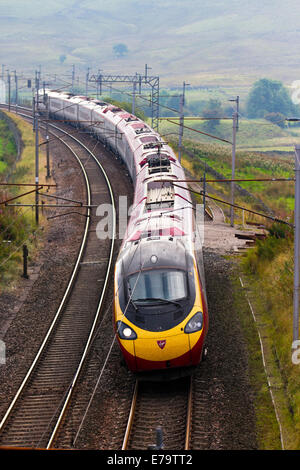 British Railways  Descending Virgin Voyager Train at Shap, West Coast Line, Cumbria, UK Stock Photo