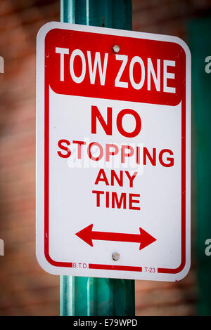 Tow Zone - NO Stopping at any time - Time. USA Stock Photo