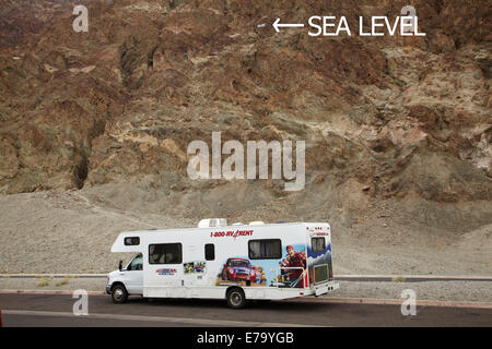 RV, and sea level sign 282 ft / 86 m above Badwater Basin, the (lowest land in North America), Death Valley National Park, Mojav Stock Photo