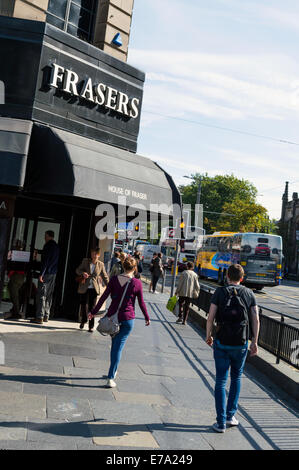 Shoppers walking past Frasers department store in Princes Street Edinburgh Stock Photo