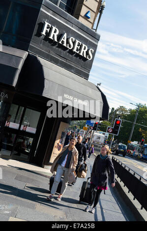 Shoppers walking past Frasers department store in Princes Street Edinburgh Stock Photo