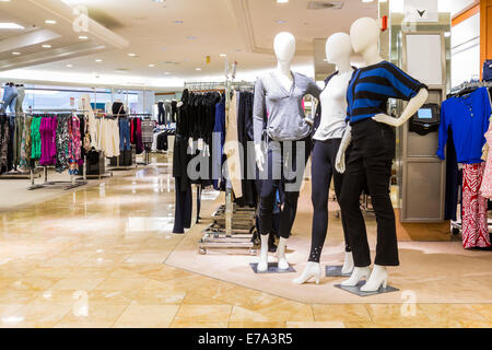 Interior of a fashion and designer clothing store. Stock Photo