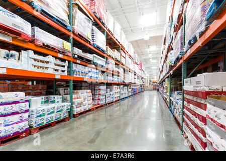 Aisle in a Costco store with napkins, towels and other paper products Stock Photo