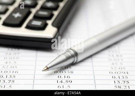 Financial statements. Calculator, ballpoint pen on financial statements. SDOF. Close-up. Stock Photo