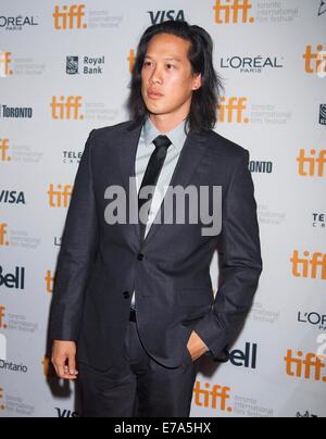 Toronto, Canada. 10th Sep, 2014. Actor Leonard Wu poses for photos before the world premiere of the film 'Revenge of The Green Dragons' at Ryerson Theater during the 39th Toronto International Film Festival in Toronto, Canada, Sept. 10, 2014. Credit:  Zou Zheng/Xinhua/Alamy Live News Stock Photo