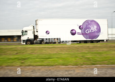 Panning a Gist Logistics articulated lorry with rear sync flash travelling along the Kingsway Dual Carriageway in Dundee, UK Stock Photo