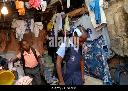Brother and sister in school uniforms, Camp Icare for earthquake refugees, Fort National, Port-au-Prince, Haiti Stock Photo